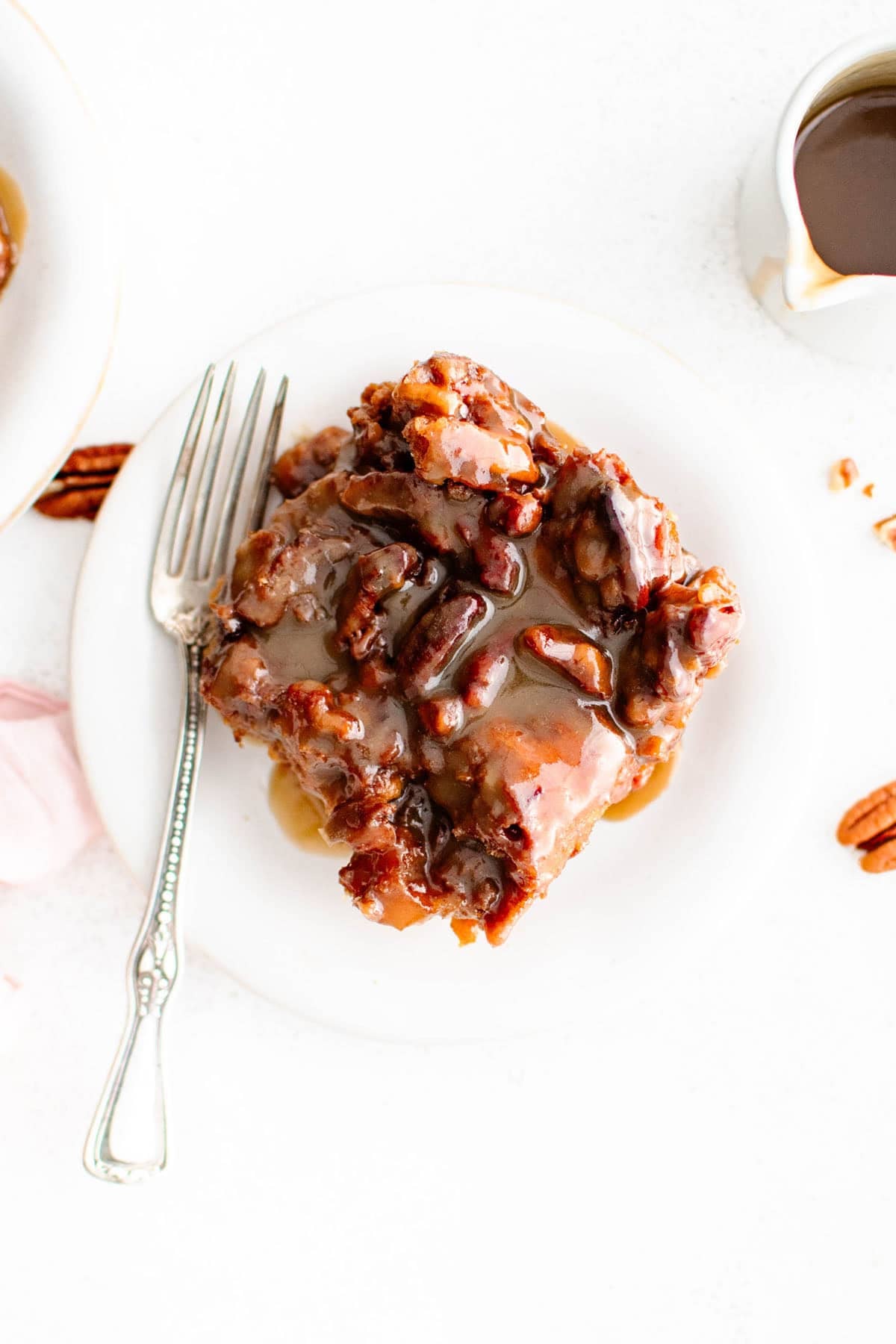 a serving of sticky bun French toast casserole on a plate with a fork